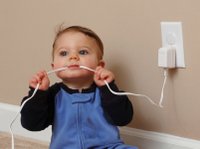 baby chewing a elec cord